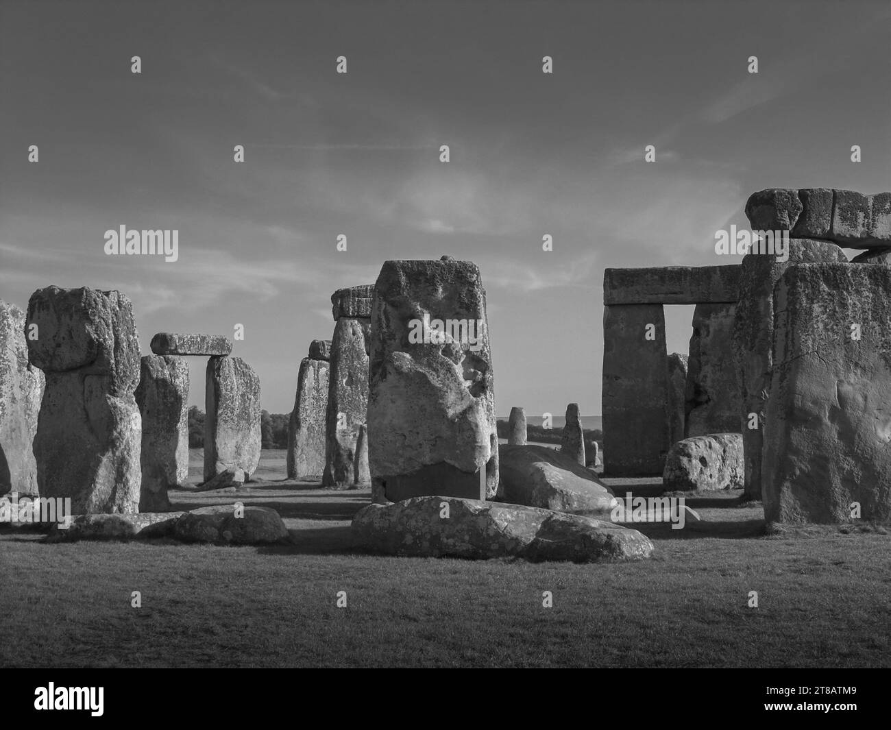 Stonehenge, Neolithic standing stones, stone circle monument.  Mythical connection with Merlin. Wiltshire, England, United Kingdom.  Monochrome. Stock Photo