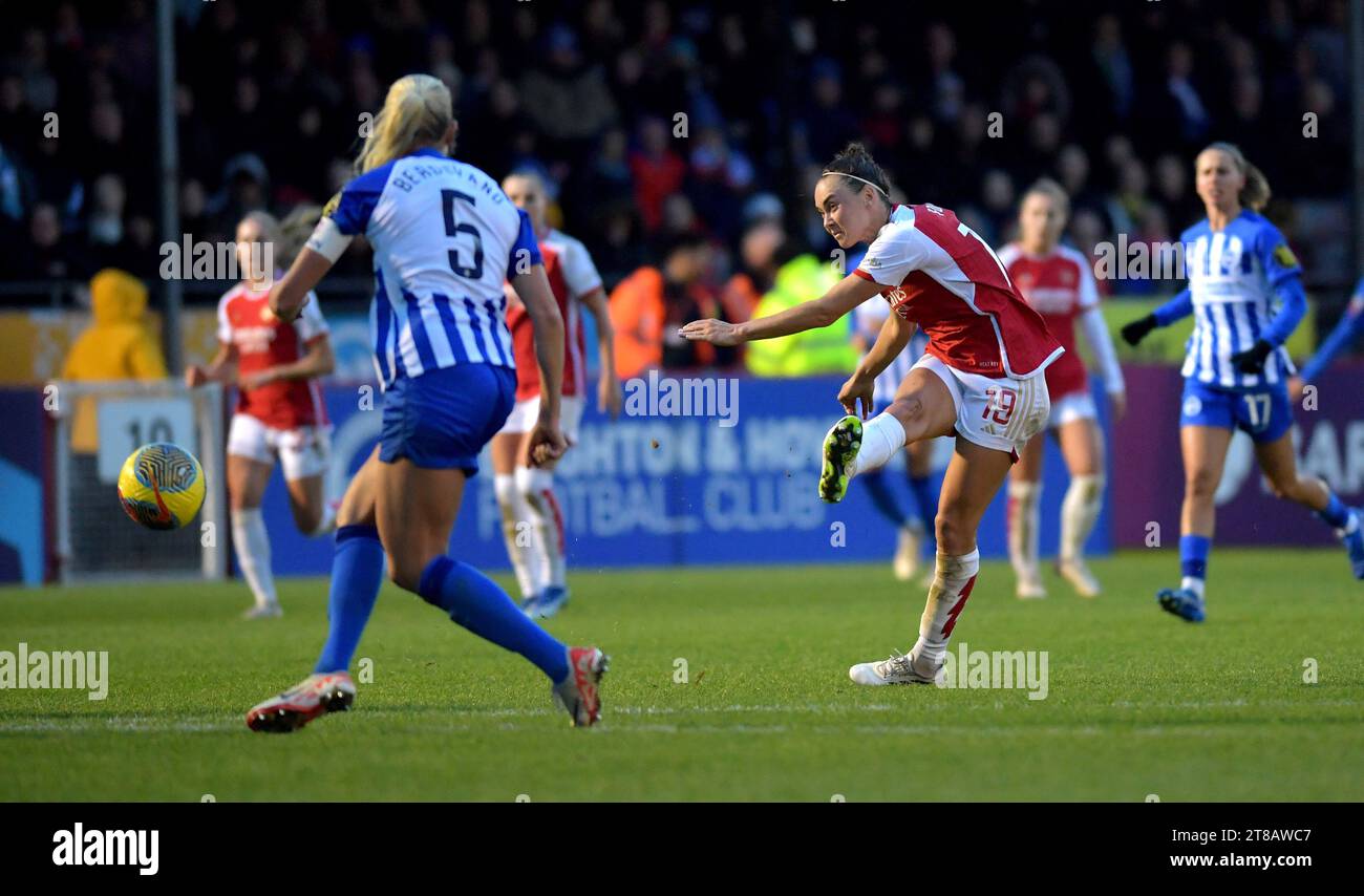 Crawley UK 19th November 2023 - Caitlin Foord of Arsenal shoots and scores their second goal  during the Barclays  Women's Super League football match between Brighton & Hove Albion and Arsenal at The Broadfield Stadium in Crawley : Credit Simon Dack /TPI/ Alamy Live News Stock Photo