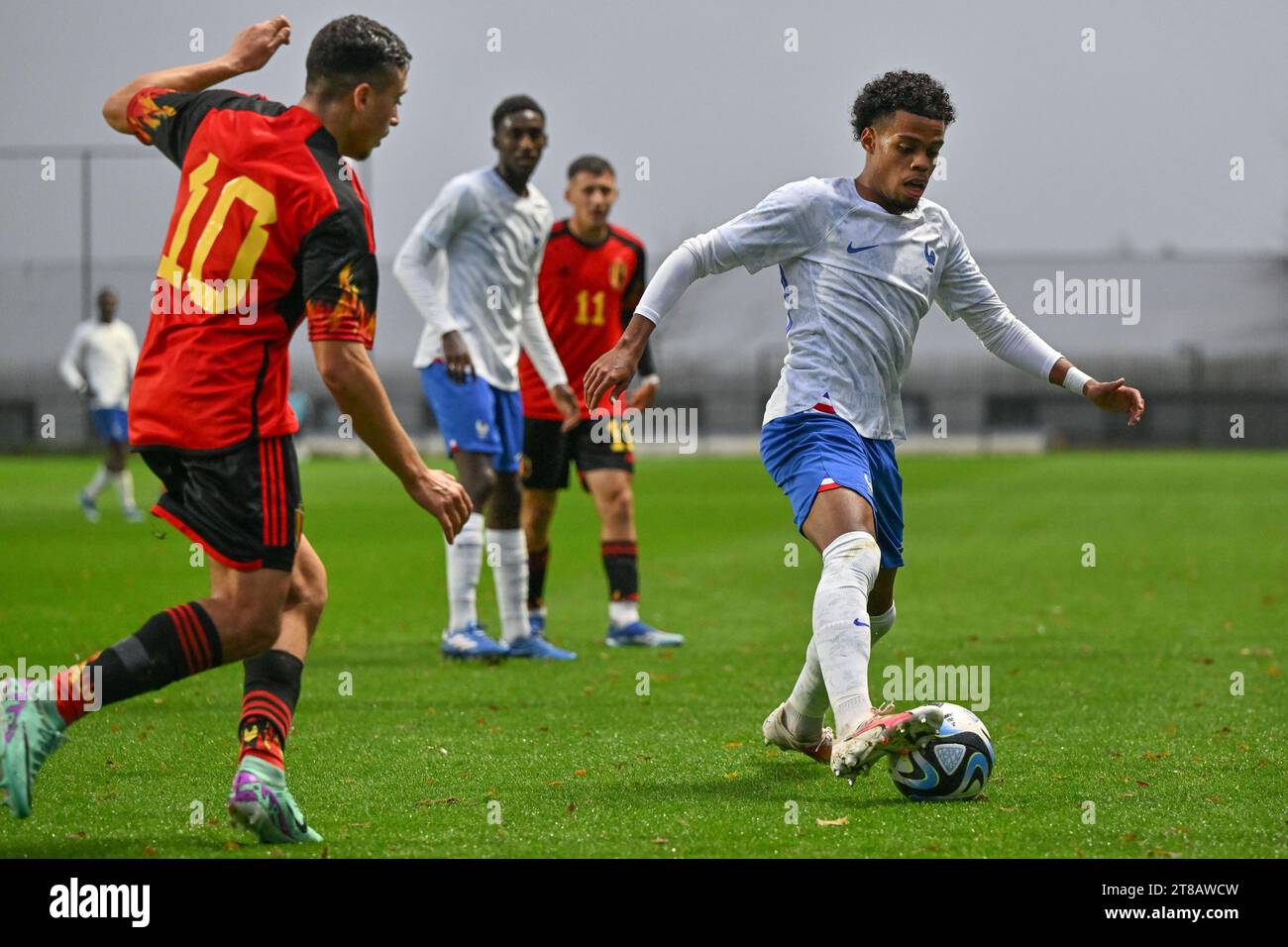 Tubize, Belgium. 18th Nov, 2023. Mohamed Salah El Boukammiri (10) of Belgium pictured defending on Therence KOUDOU (20) of France during a friendly soccer game between the national under 20 teams of Belgium and France on Saturday 18 November 2023 in Tubize, Belgium . Credit: sportpix/Alamy Live News Stock Photo