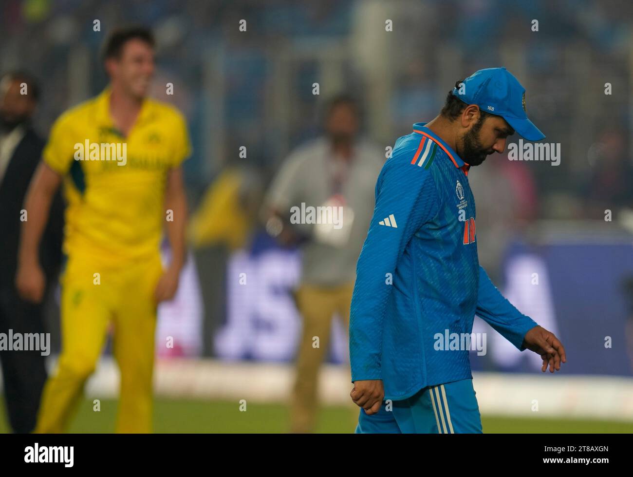 India's captain Rohit Sharma walks back to pavilion after his team lost ...