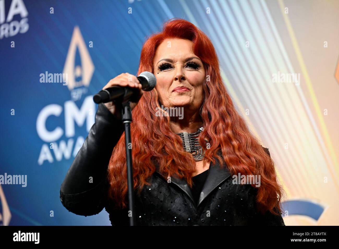 Wynonna Judd speaks in the press room at the 57th Annual CMA Awards on