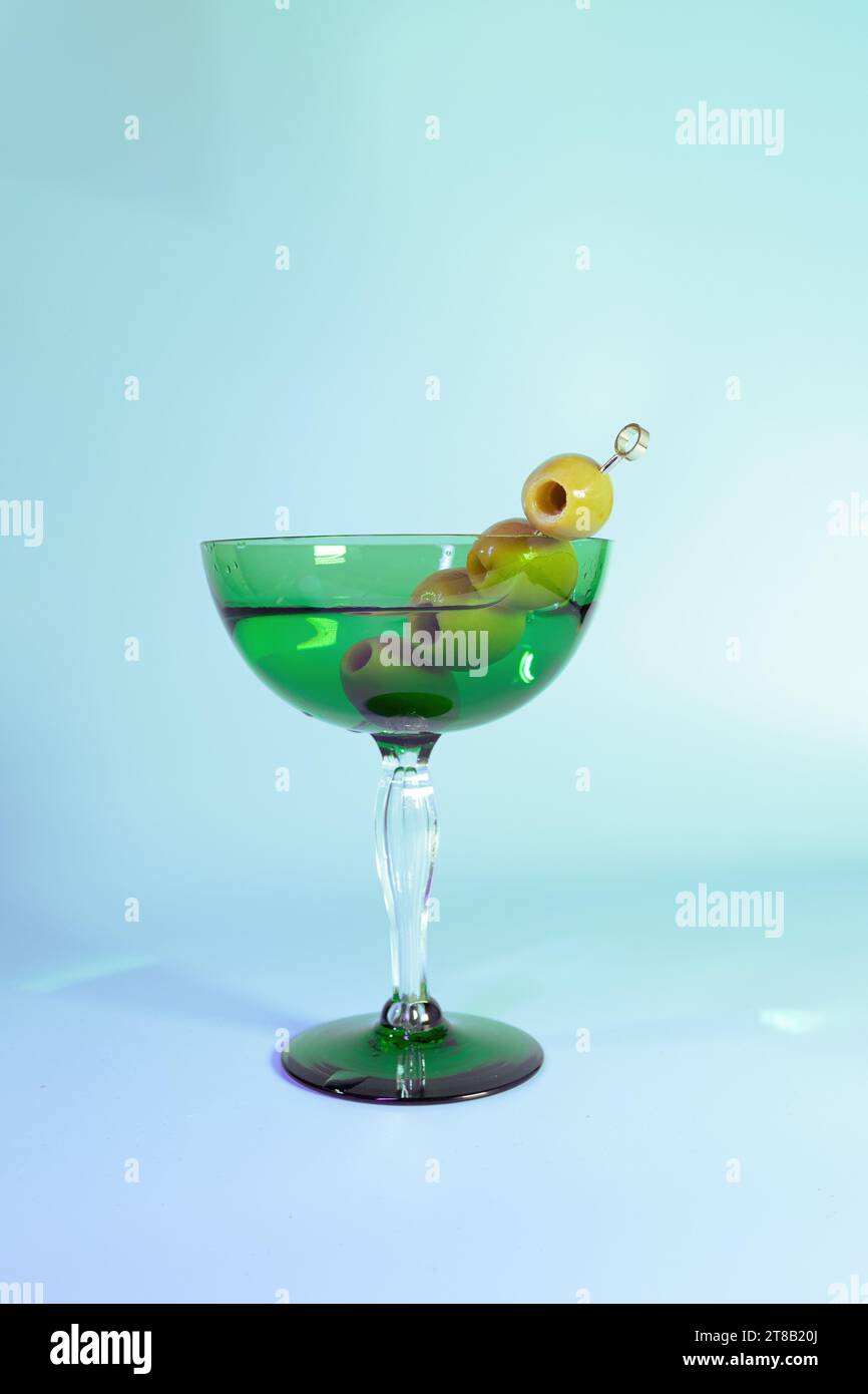 Elegant Art Deco Dirty Martini with Olives in a Vintage Green Glass Stock Photo