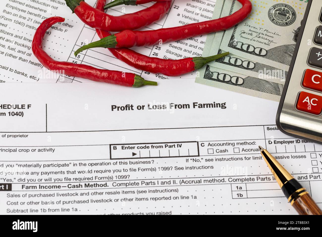 Hot pepper and farming profit or loss tax form with calculator. Vegetable and fruit farm income, finances and management concept. Stock Photo