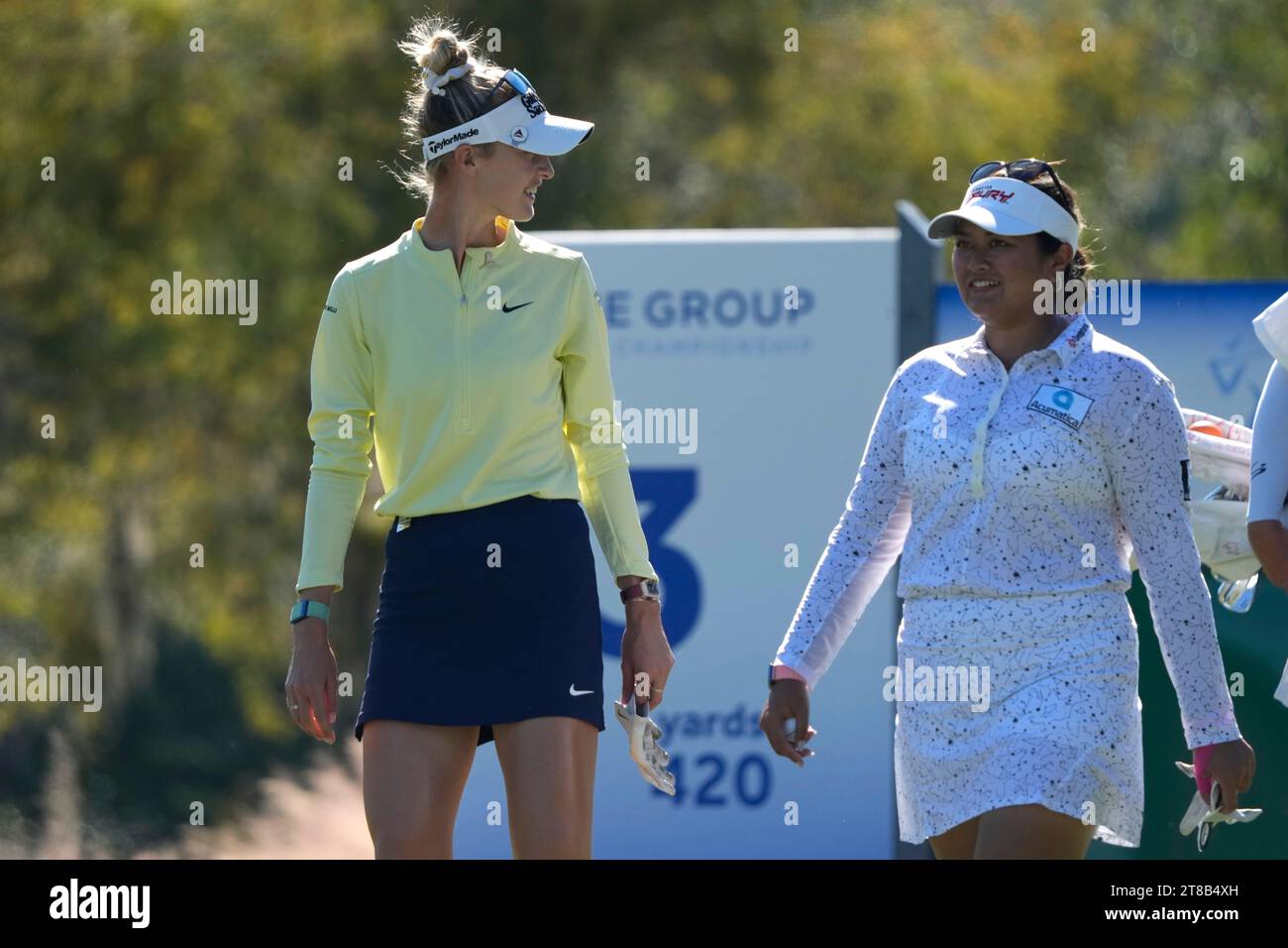 Nelly Korda, left, walks to the third tee with Lilia Vu, right, during