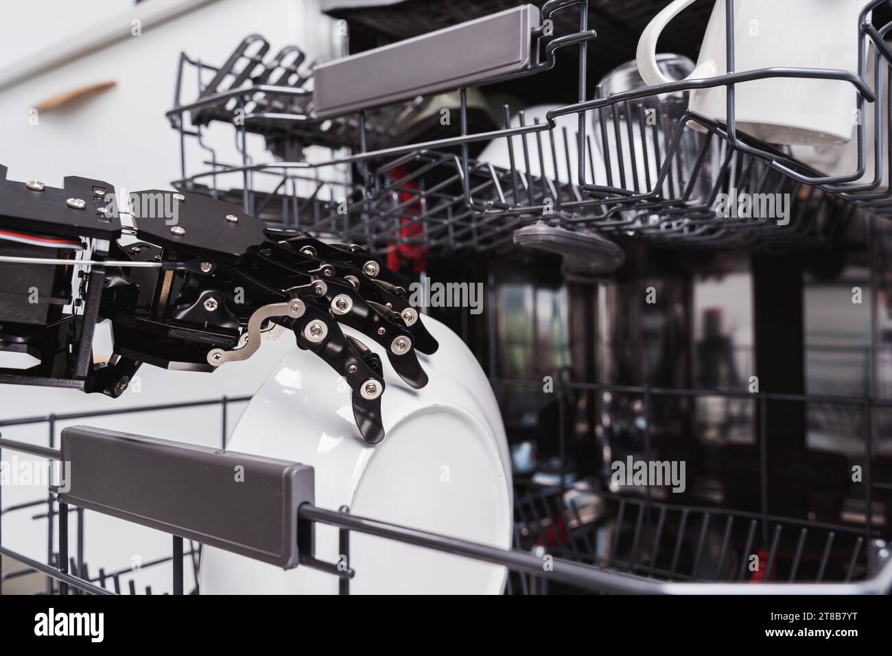 Real robot's hand and dishwasher machine. Concept of Artificial