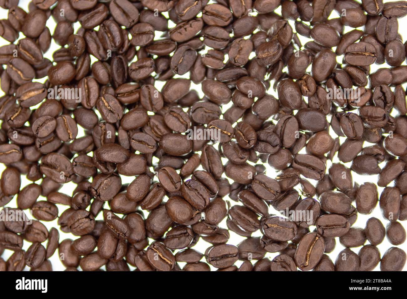 Roasted coffee beans background.Roasted coffee beans on a light ...