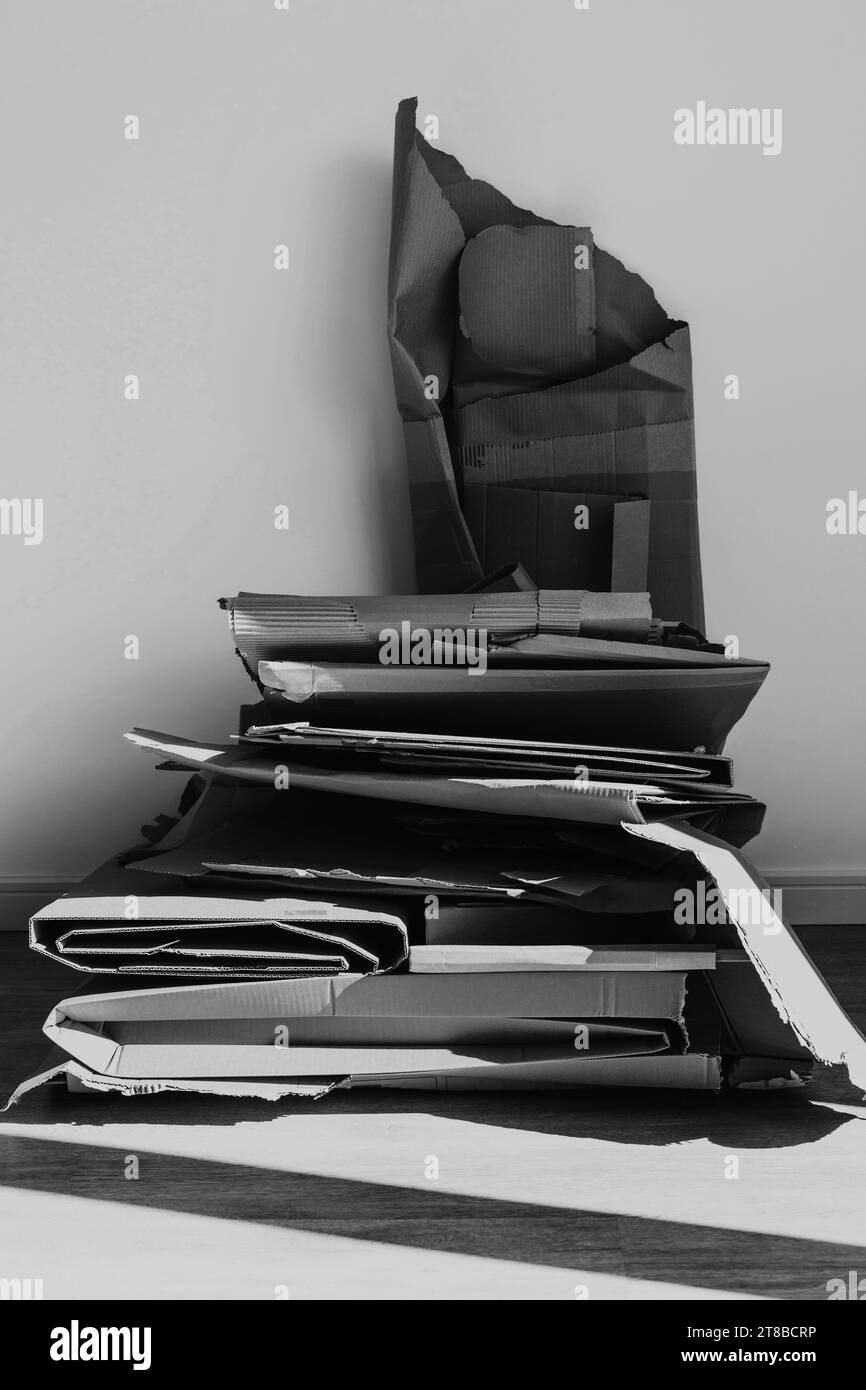 Stack of Cardboard Waste at home. Concepts of Paper Recycling and Waste