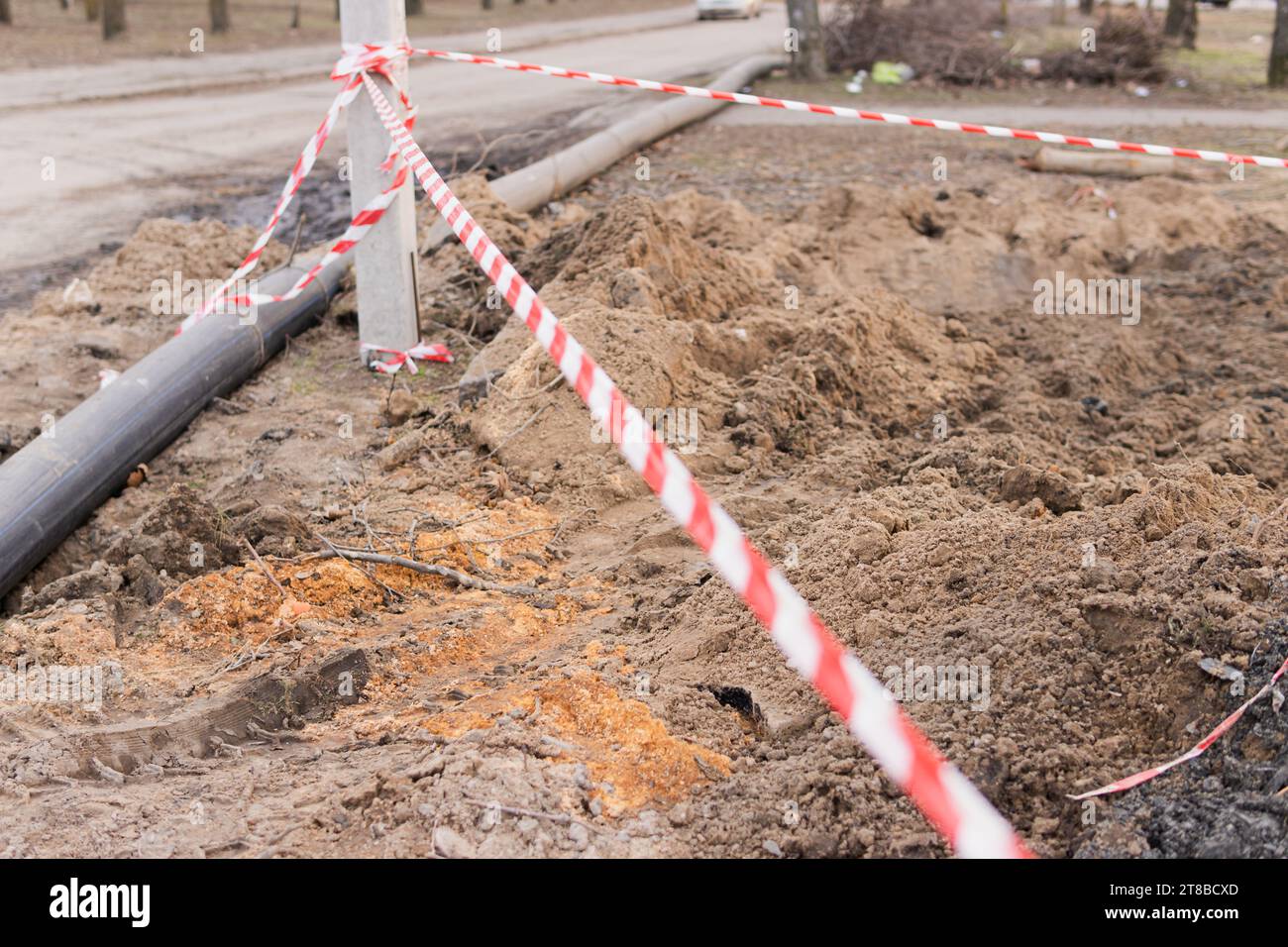 Plastic pipes in the ground during construction on the street Stock