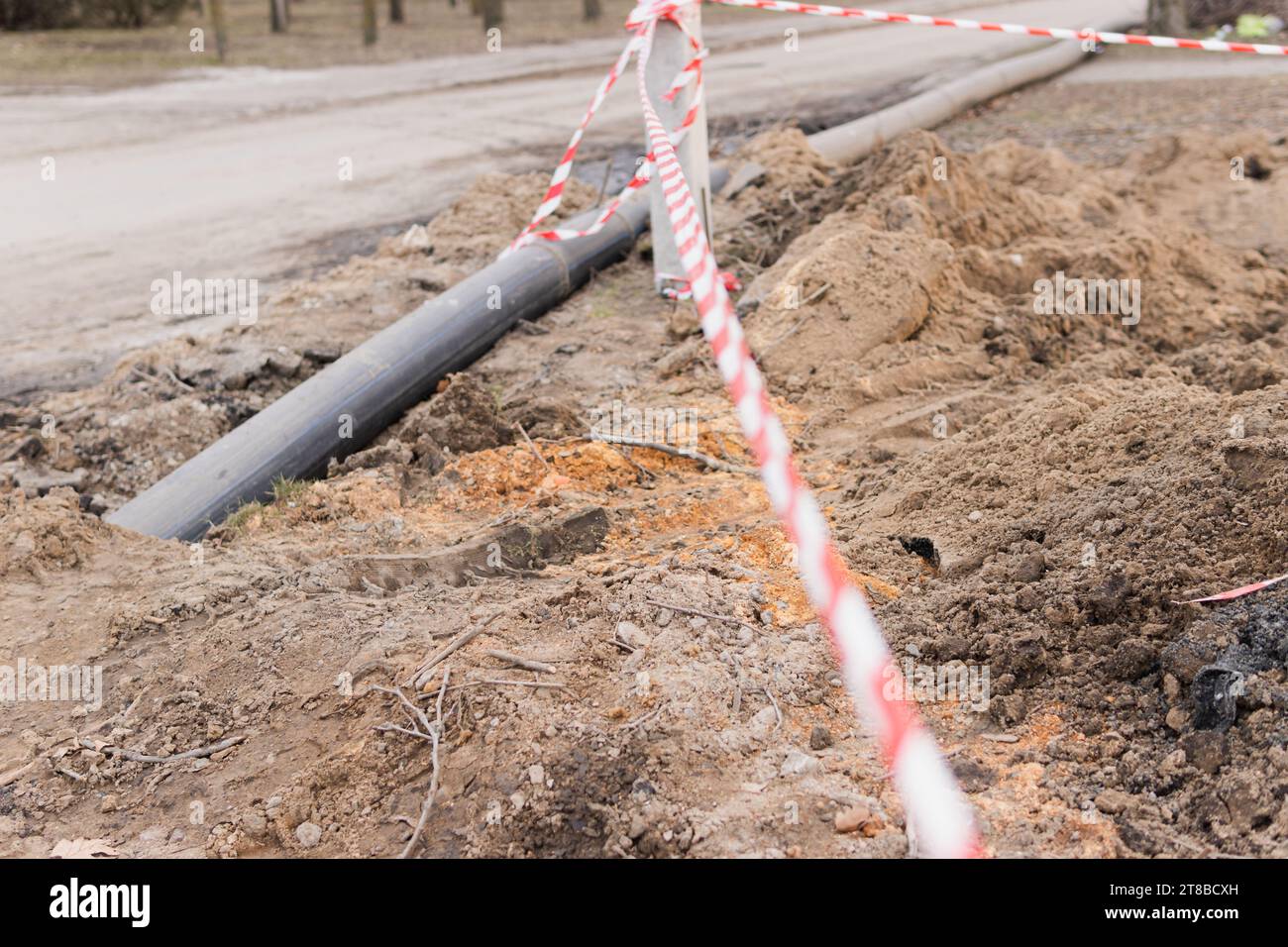 Plastic pipes in the ground during construction on the street Stock