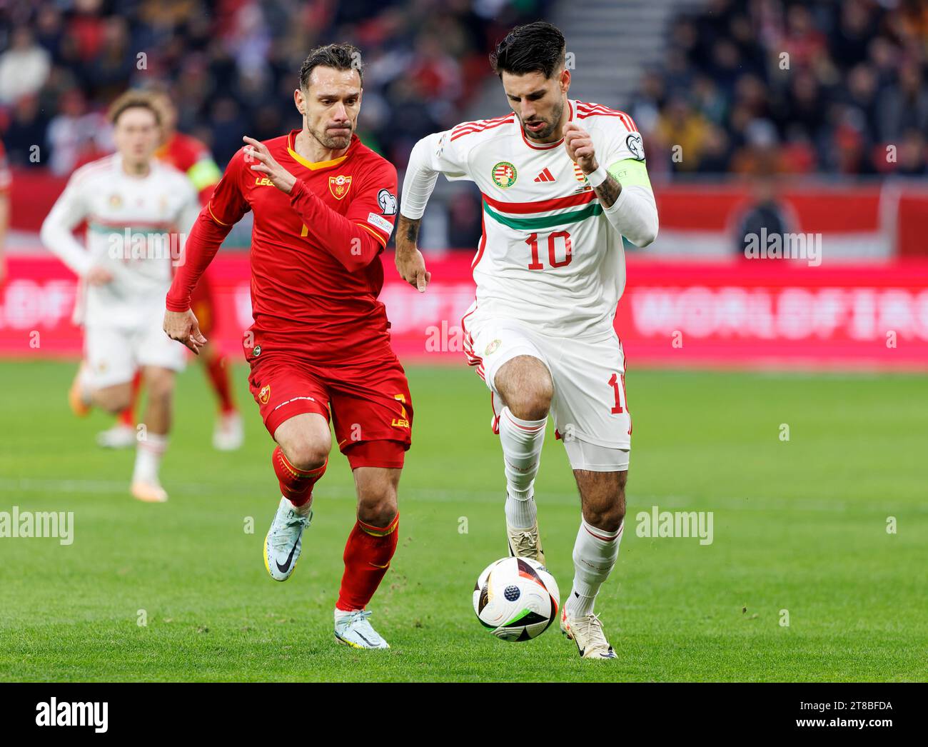 Budapest, Hungary. 19th November, 2023. Marko Vesovic of Montenegro challenges Dominik Szoboszlai of Hungary during the UEFA EURO 2024 qualifying round match between Hungary and Montenegro at Puskas Arena on November 19, 2023 in Budapest, Hungary. Credit: Laszlo Szirtesi/Alamy Live News Stock Photo