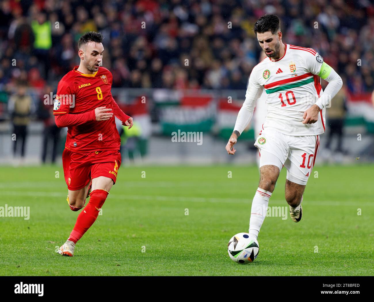 Budapest, Hungary. 19th November, 2023. Marko Jankovic of Montenegro challenges Dominik Szoboszlai of Hungary during the UEFA EURO 2024 qualifying round match between Hungary and Montenegro at Puskas Arena on November 19, 2023 in Budapest, Hungary. Credit: Laszlo Szirtesi/Alamy Live News Stock Photo