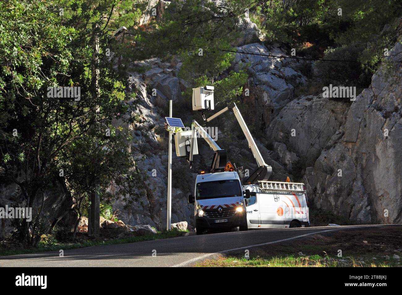Installation of solar lighting with bucket truck on the road to Mont Faron Toulon Var Provence Stock Photo