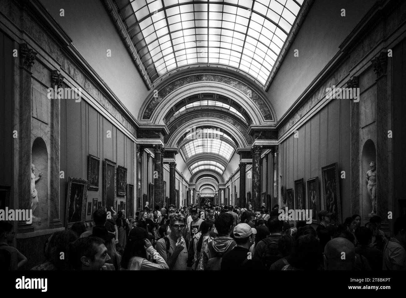 A black and white ornate hall in the Louvre Museum in Paris, France. Stock Photo