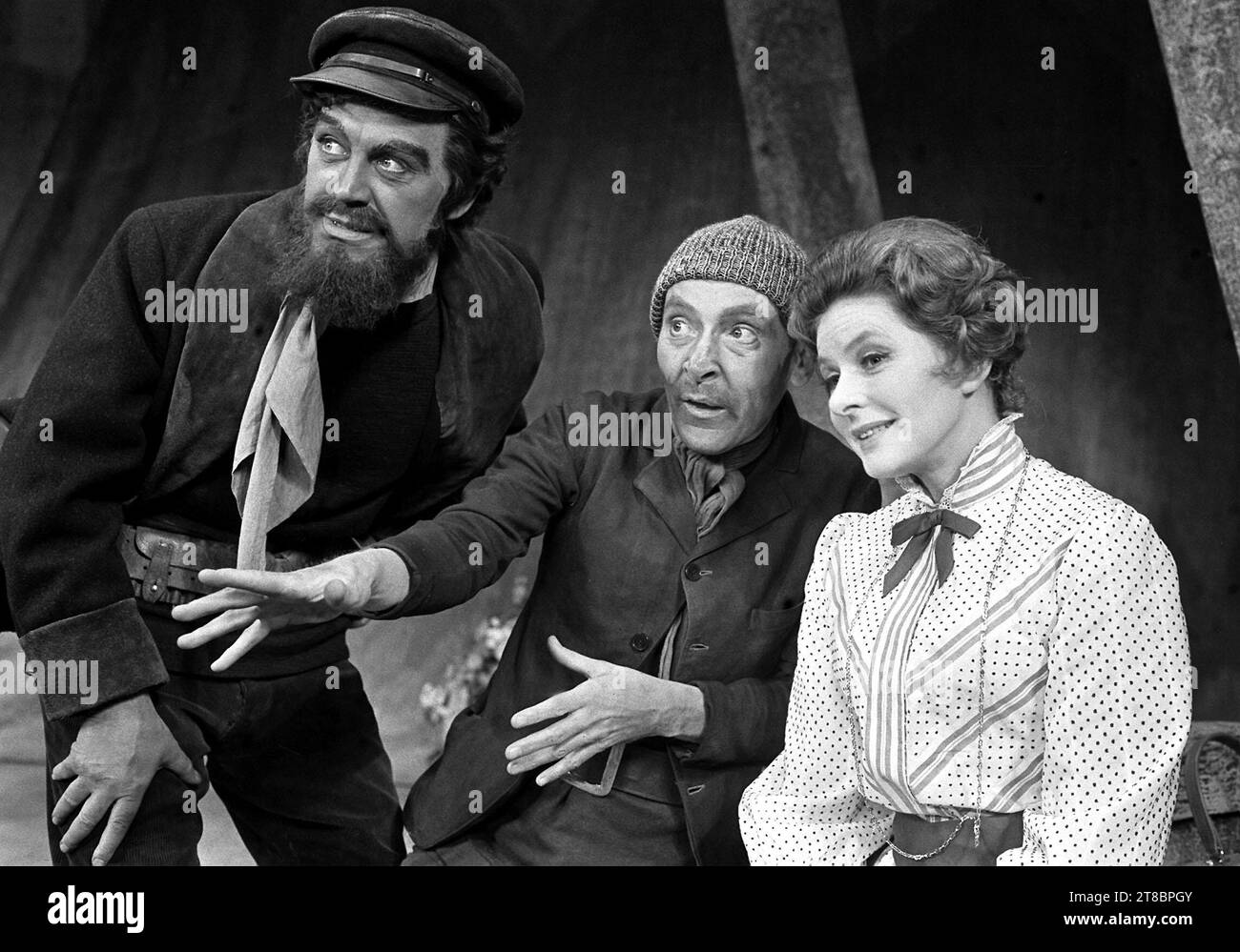File photo dated 15/2/1971 of swedish actress Ingrid Bergman, as Lady Cicely Waynflete, iwith Kenneth Williams, as Drinkwater and Joss Ackland as Captain Brassbound (left), during a dress rehearsal at the Cambridge Theatre, London, for a revival of Bernard Shaw's 'Captain Brassbound's Conversion'. British actor Joss Ackland has died at the age of 95, his family said in a statement. Issue date: Sunday November 19, 2023. Stock Photo
