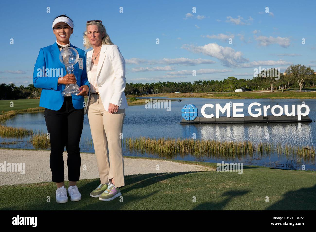 Amy Yang, of South Korea, left, poses with LPGA Commissioner Mollie