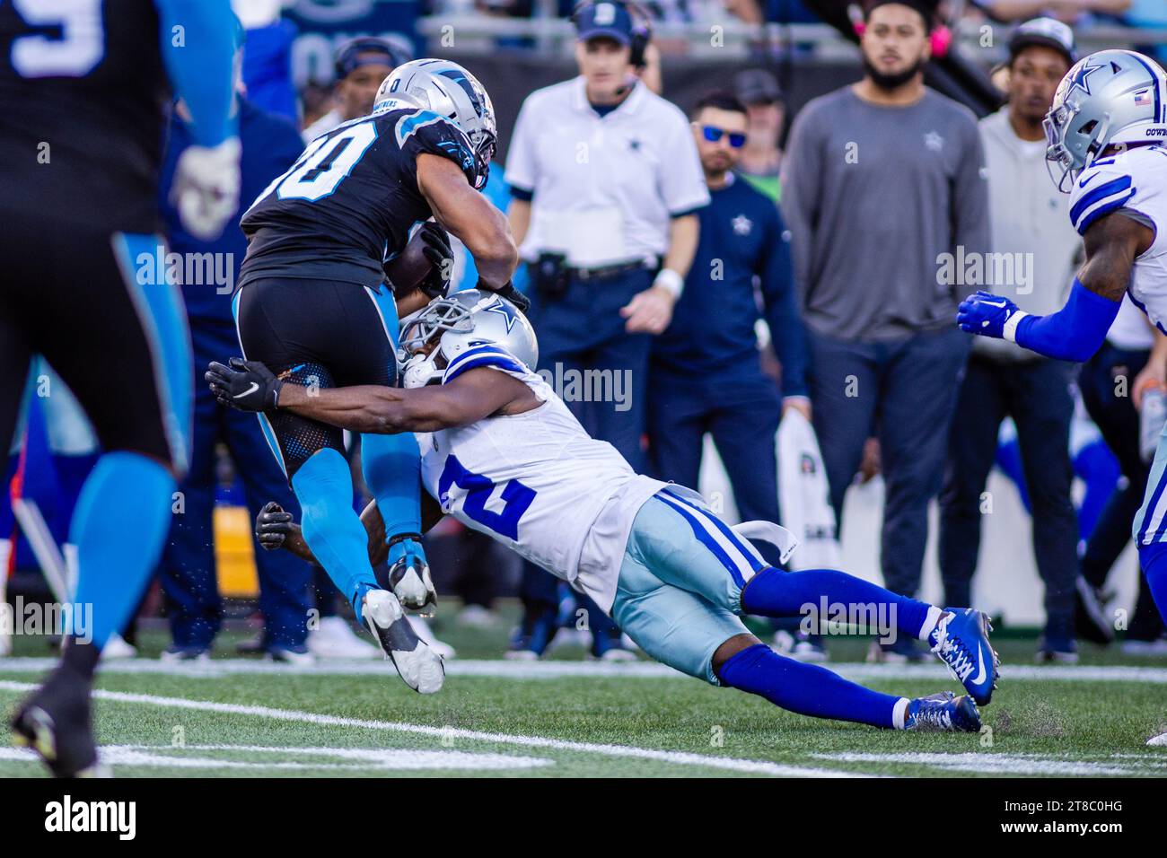Charlotte, NC, USA. 19th Nov, 2023. Carolina Panthers running back Chuba Hubbard (30) is tackled by Dallas Cowboys cornerback Jourdan Lewis (2) during the fourth quarter of the NFL matchup in Charlotte, NC. (Scott Kinser/Cal Sport Media). Credit: csm/Alamy Live News Stock Photo