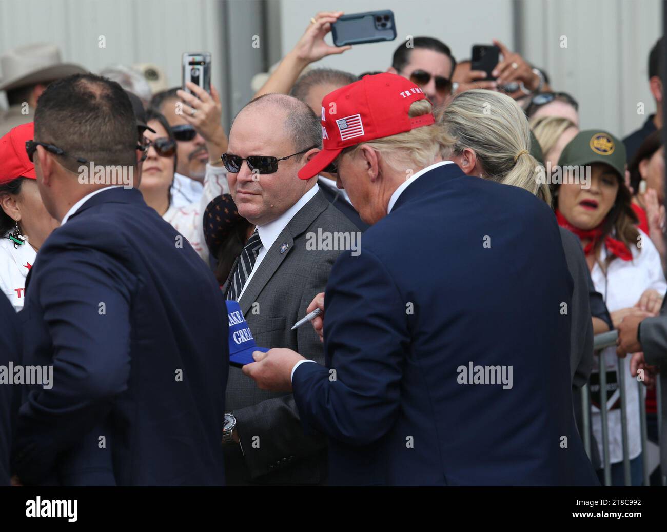 Edinburg, TX, USA. 19th Nov, 2023. Former President DONALD TRUMP signs