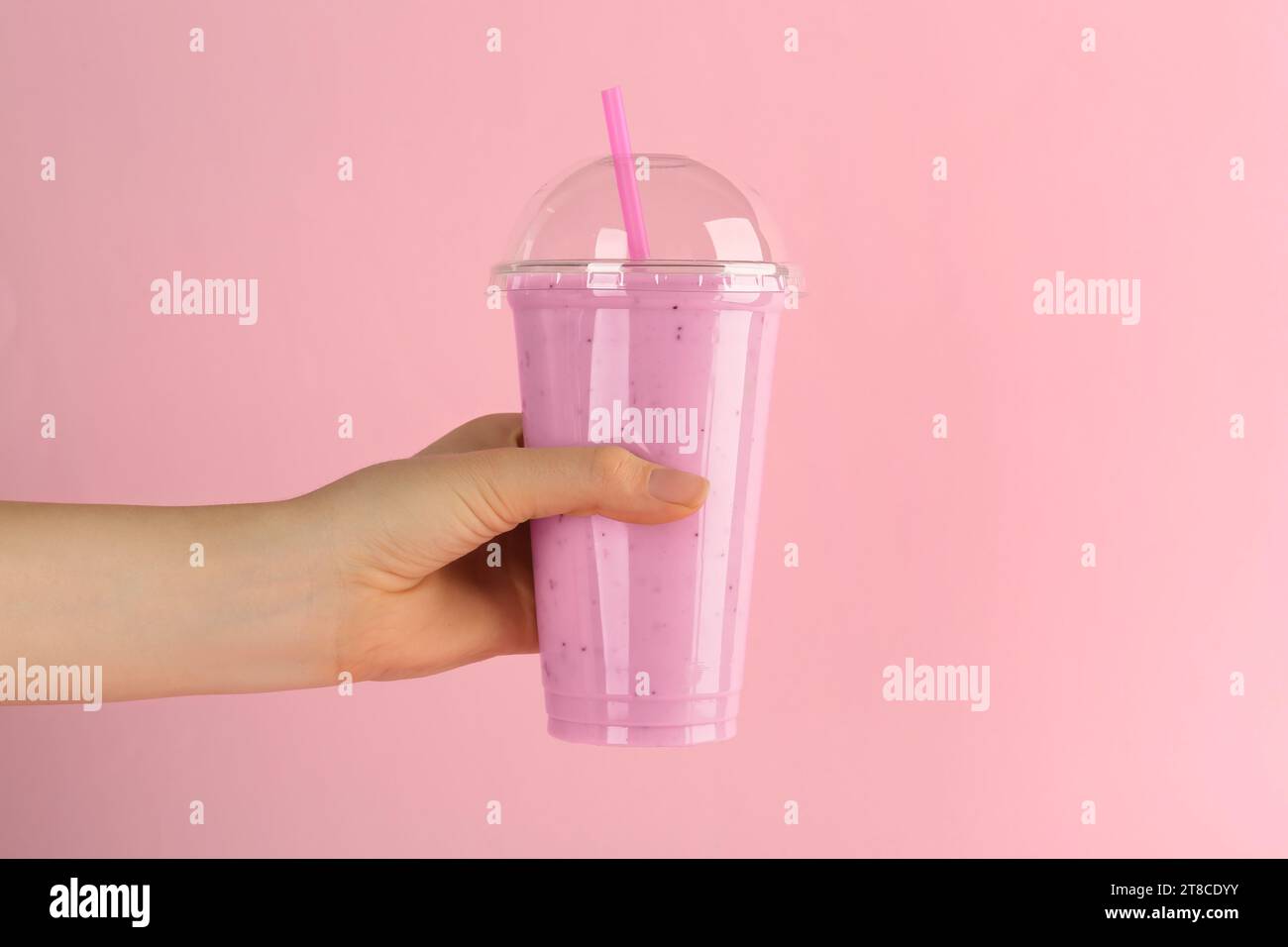 https://c8.alamy.com/comp/2T8CDYY/woman-with-plastic-cup-of-tasty-smoothie-on-pink-background-closeup-2T8CDYY.jpg