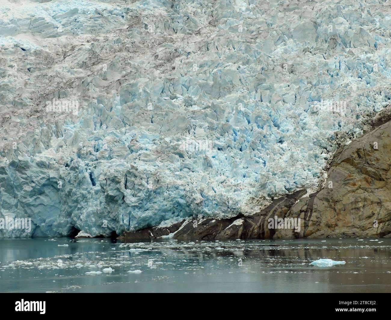 close up of the sermeq kajatleq glacier and icebergs in the steep mountains of the prince christian sound, in southern greenland, from a cruise ship Stock Photo