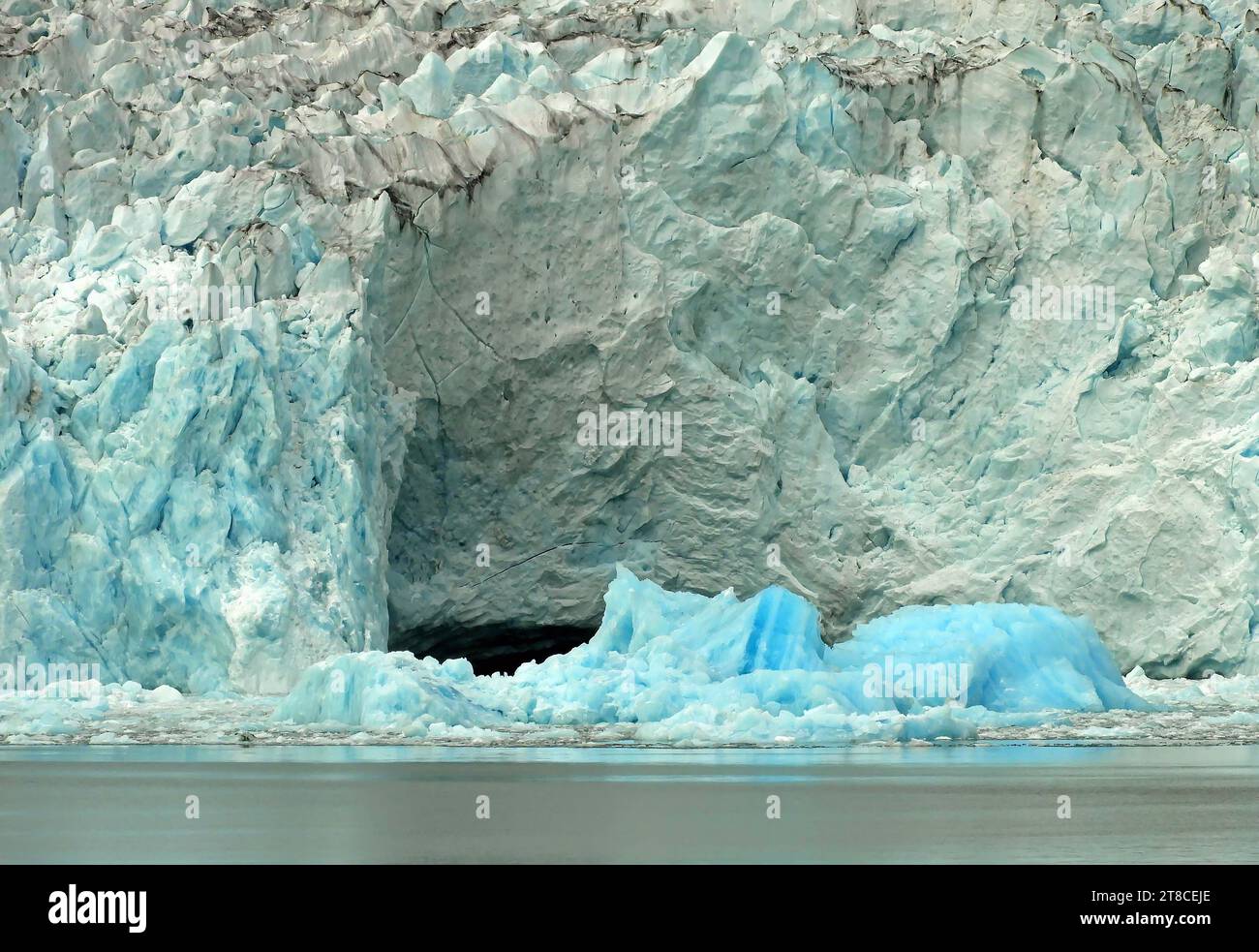 close up of the sermeq kajatleq glacier and icebergs in the steep mountains of the prince christian sound, in southern greenland, from a cruise ship Stock Photo