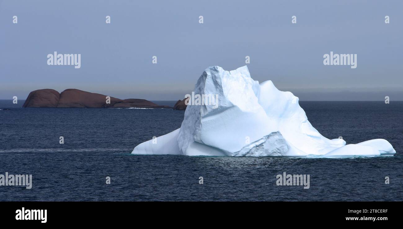 close up of  an iceberg, entering the east side of the rugged prince christian sound, in southern greenland, on a cruise ship Stock Photo