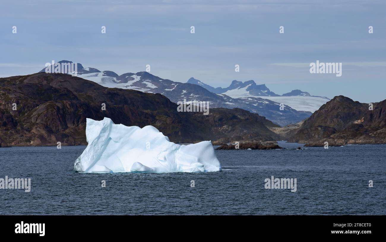 close up of  an iceberg, entering the east side of the rugged prince christian sound, in southern greenland, on a cruise ship Stock Photo