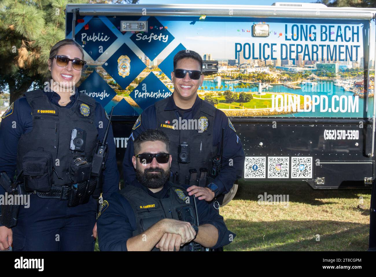 Long Beach police officers posing in front of a Long Beach Police ...