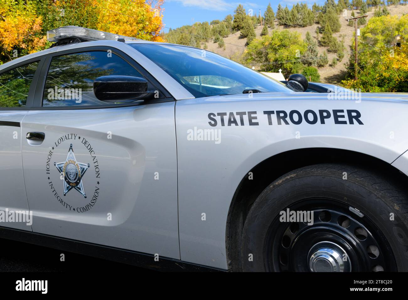 Canyon City, OR, USA - October 12, 2023; Oregon State Trooper patrol car with name and badge on silver vehicle Stock Photo