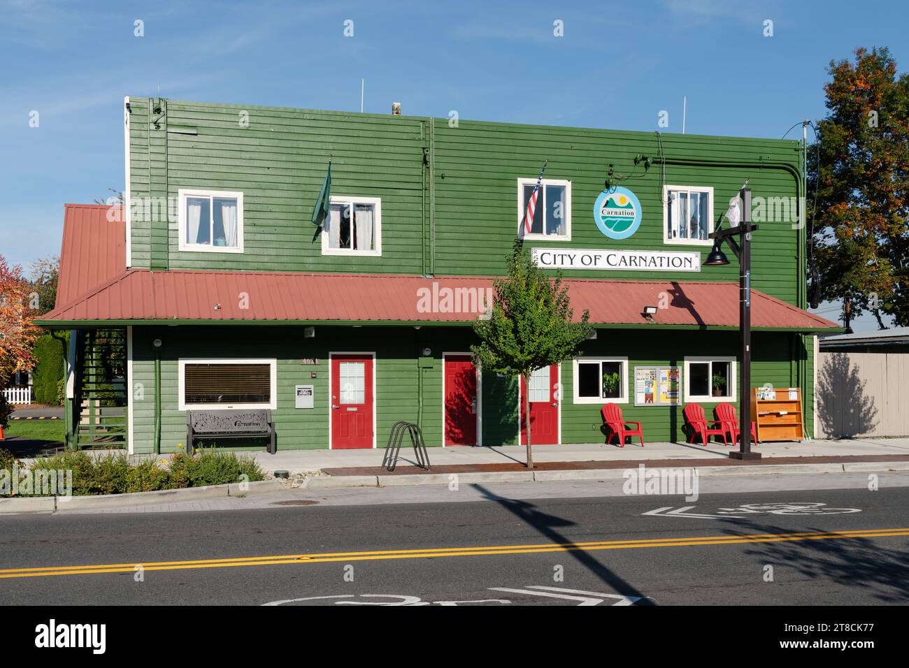 Carnation, WA, USA - October 8, 2023 ;City of Carnation green wooden building with sign and red wrap around awning Stock Photo
