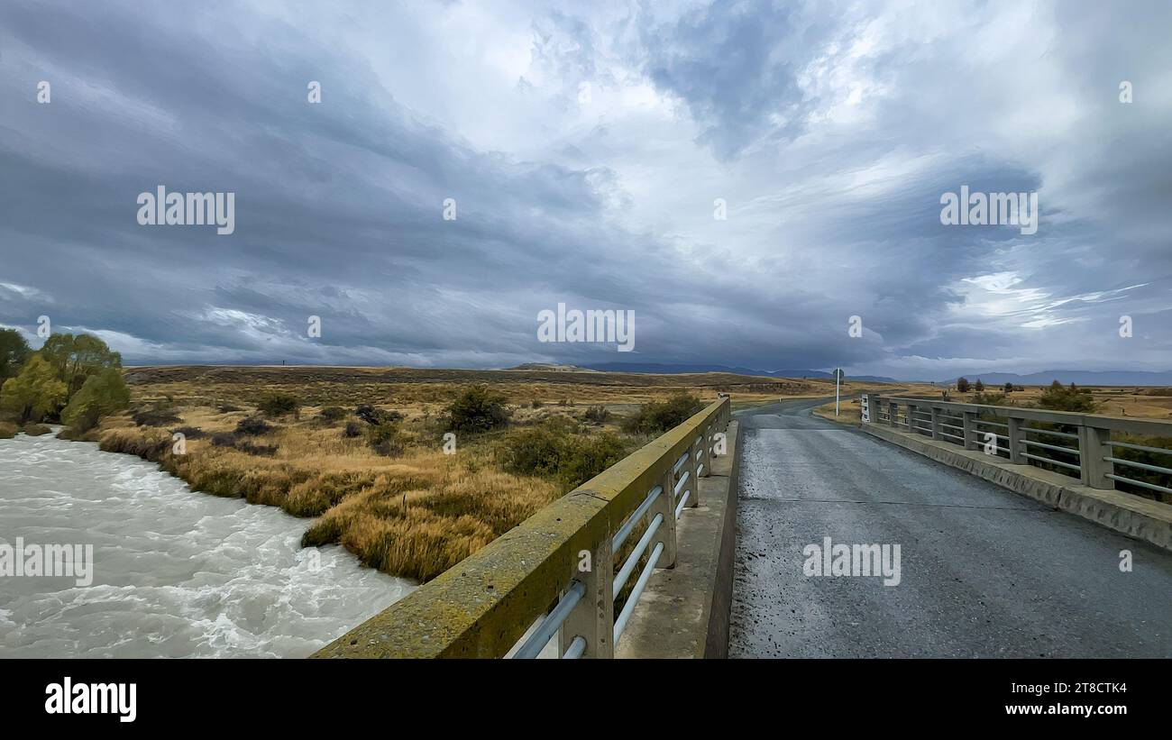 Flooded stream on the winding narrow gravel road between Lake Tekapo ...