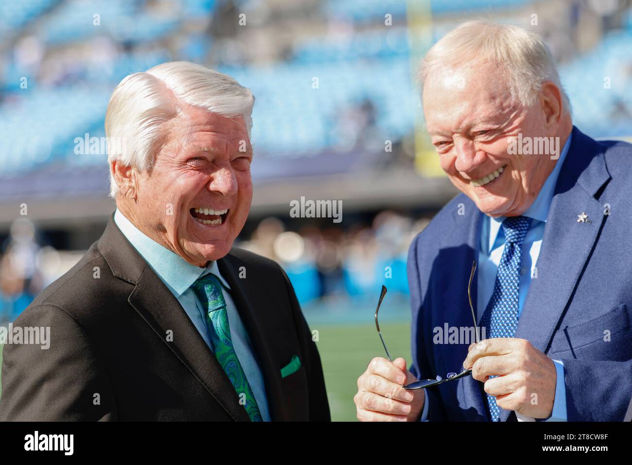 Charlotte, NC USA: Sports analyst and former Dallas Cowboys coach Jimmy Johnson talks with Cowboys owner Jerry Jones prior to an NFL game against the Stock Photo