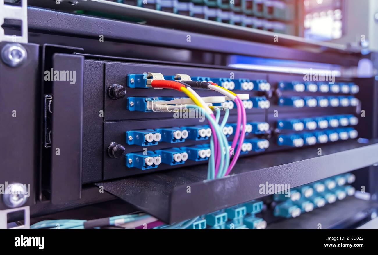 optic fiber cables connected to data center Stock Photo