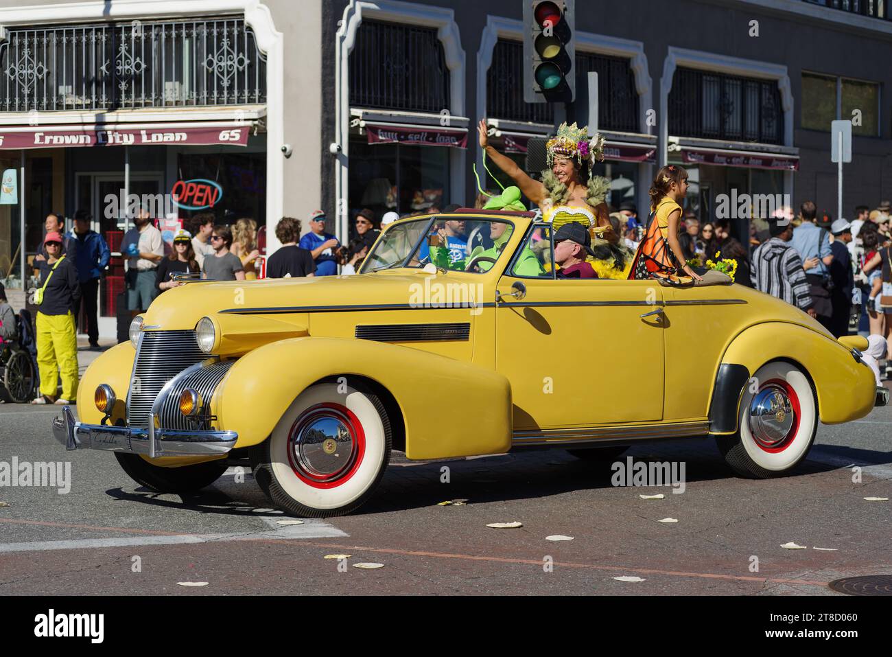 44th Doo Dah Parade in Pasadena, California. Unidentified participants including the parade queen riding in a vintage Cadillac car. Stock Photo