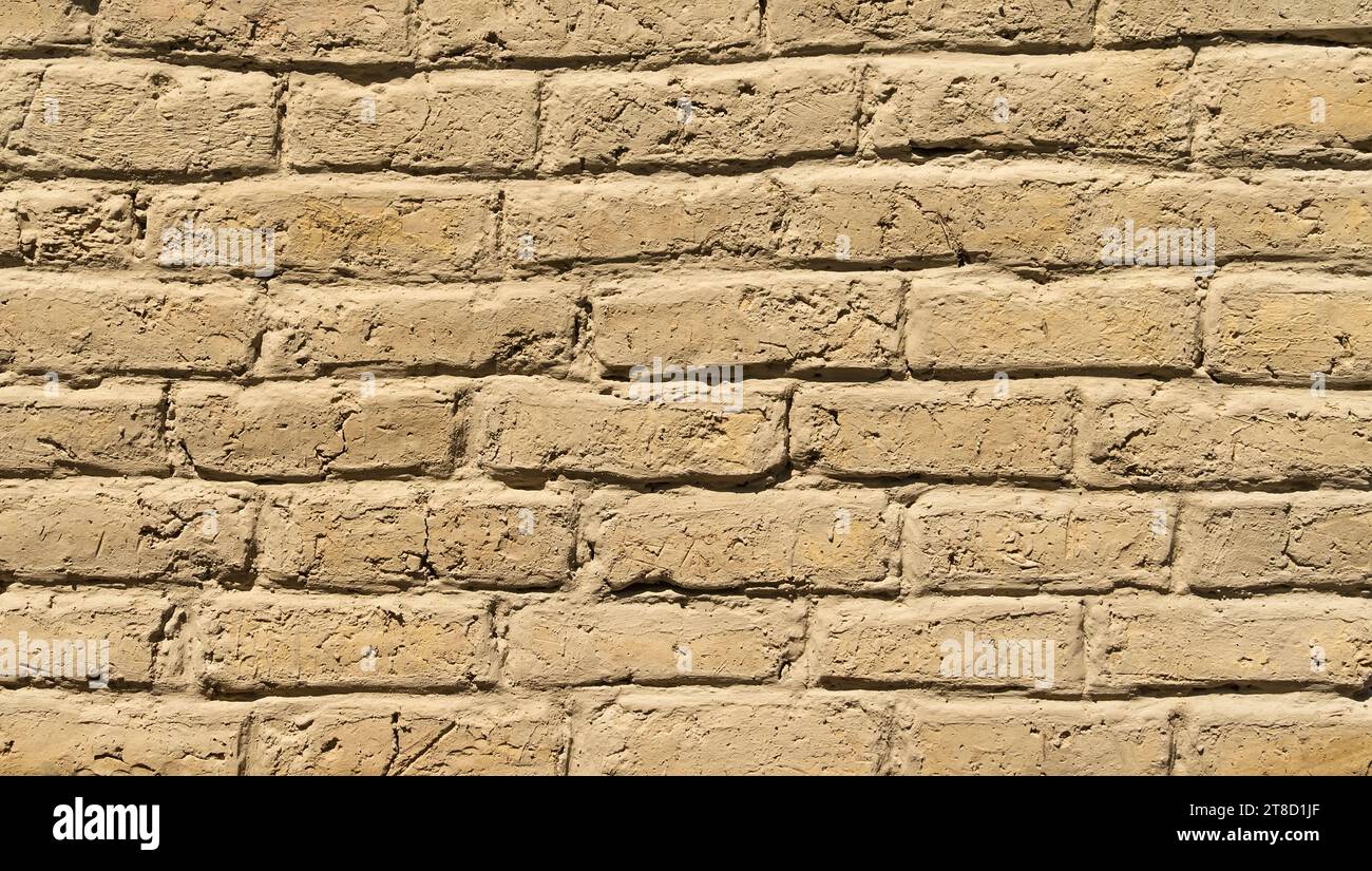 Old adobe bricks wall made of mud.Useful for backgrounds and texture. Stock Photo