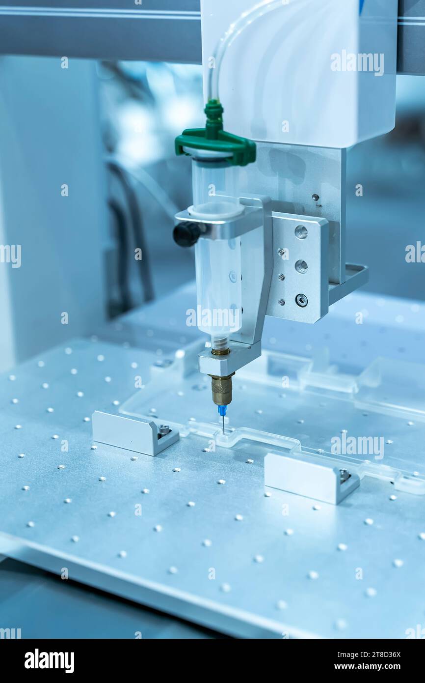automatic holding glue syringe Injection in factory Stock Photo Alamy