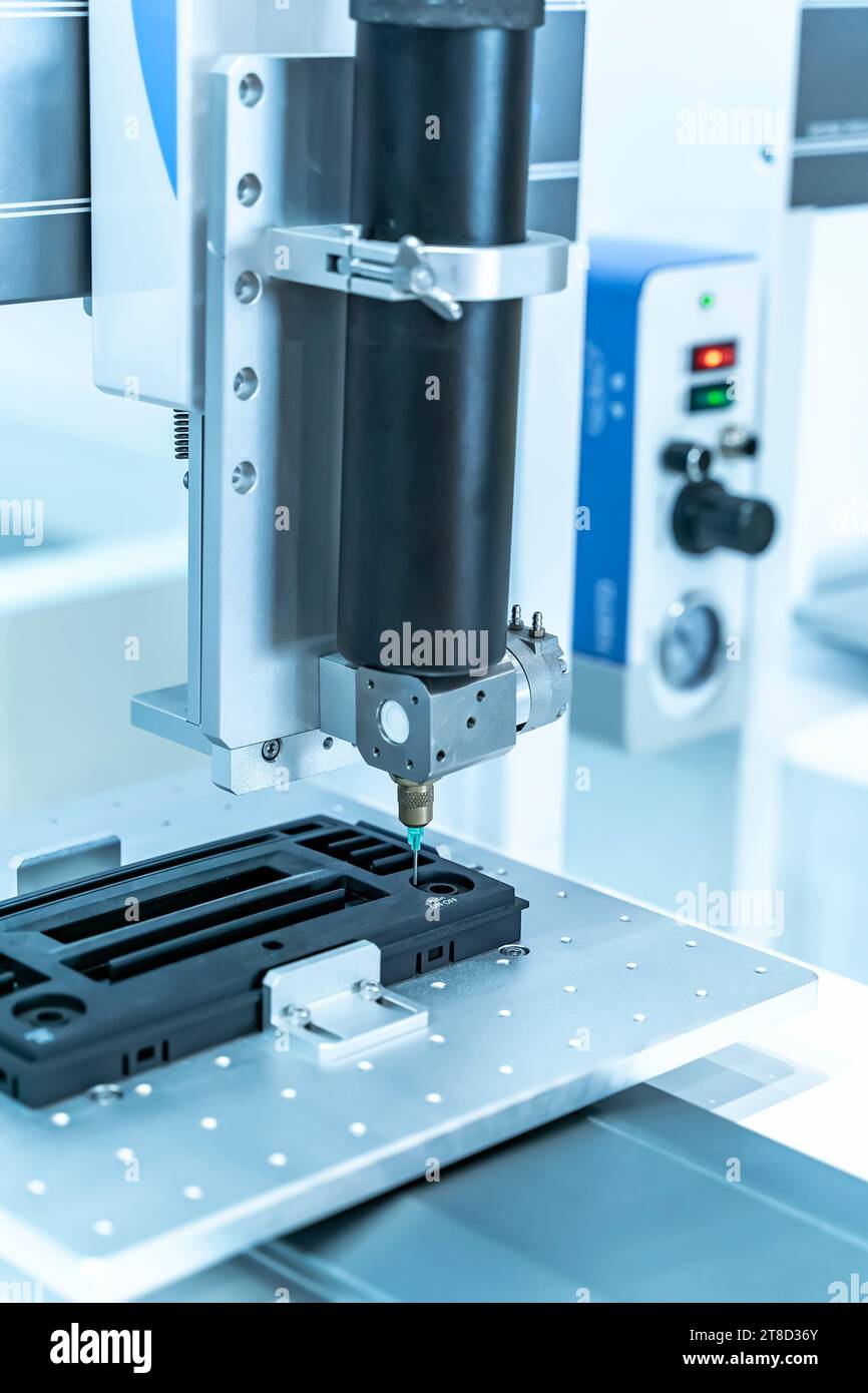 automatic holding glue syringe Injection in factory Stock Photo Alamy