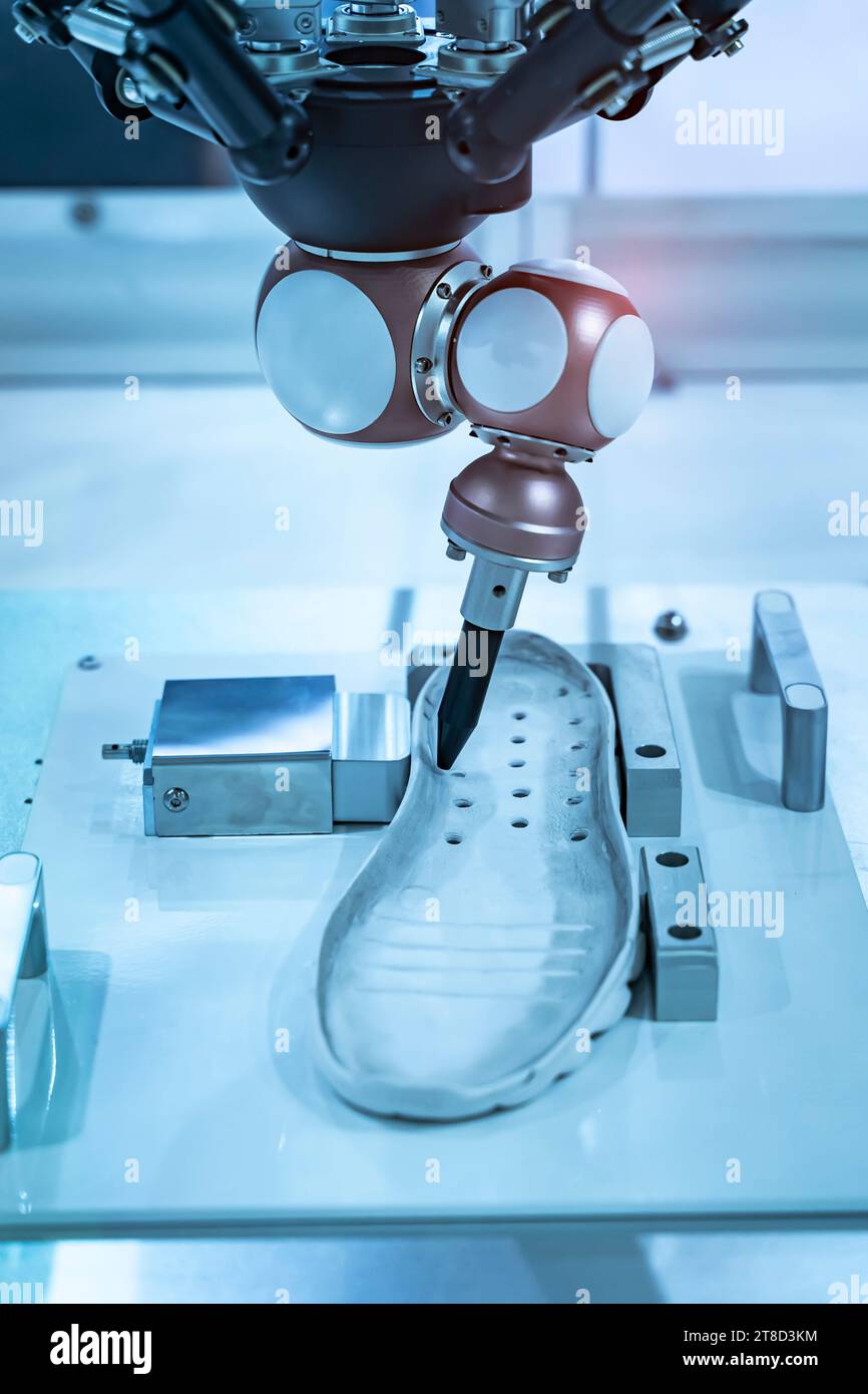 Robot holding glue syringe Injection on shoe in intellegence factory