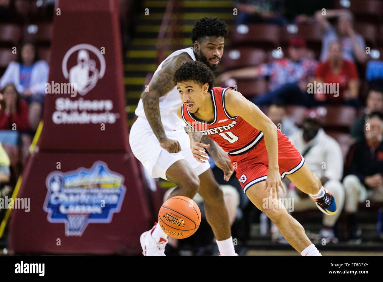 Charleston, South Carolina, USA. 19th Nov, 2023. Dayton Flyers guard JAVON BENNETT (0) dribbles the ball nearly falling down during the Charleston Classic Championship game against the Houston Cougars at TD Arena (Credit Image: © Maxwell Vittorio/ZUMA Press Wire) EDITORIAL USAGE ONLY! Not for Commercial USAGE! Stock Photo