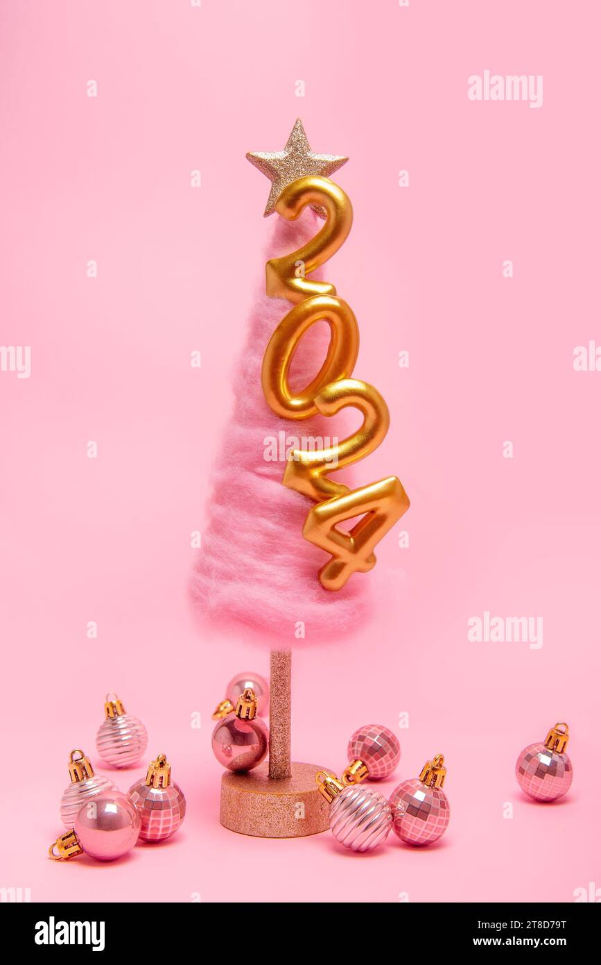 Isolated bright pink background fluffy creative Christmas tree made of
