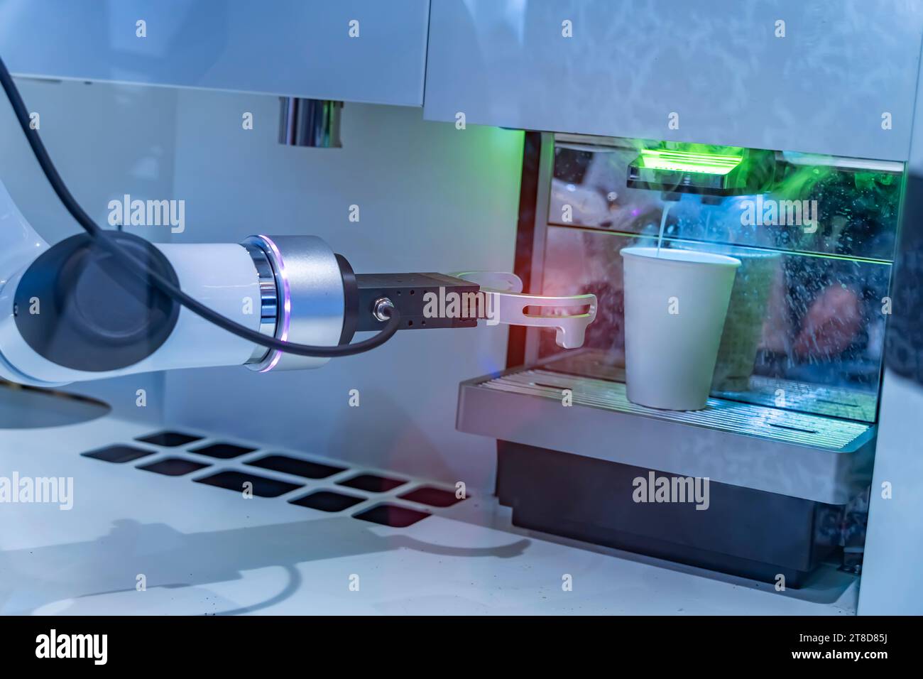 robotic arm preparing coffee in coffee machine Stock Photo
