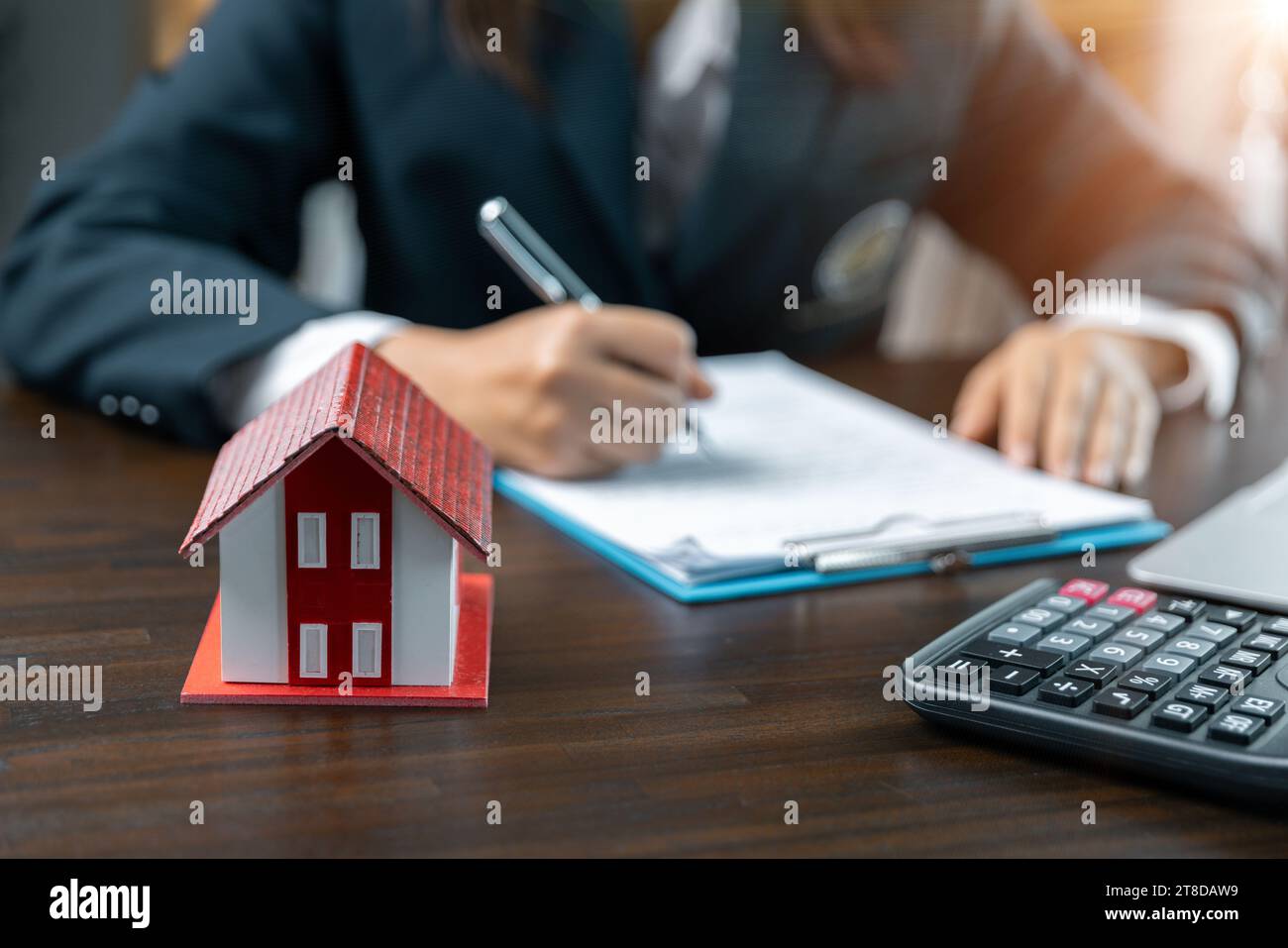 Discussion with a real estate agent, House model with agent and ...