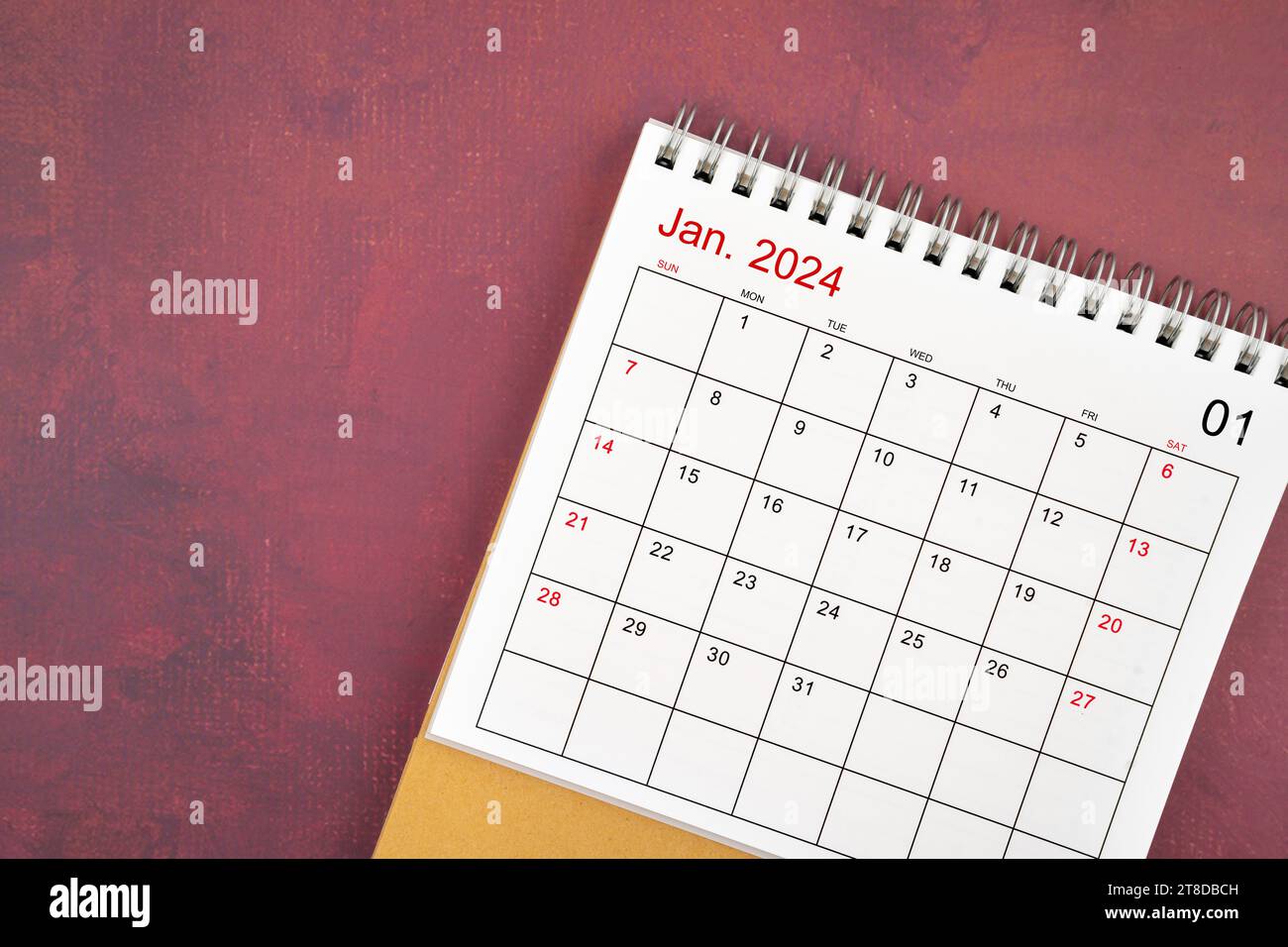 January 2024 desk calendar on red color background Stock Photo - Alamy