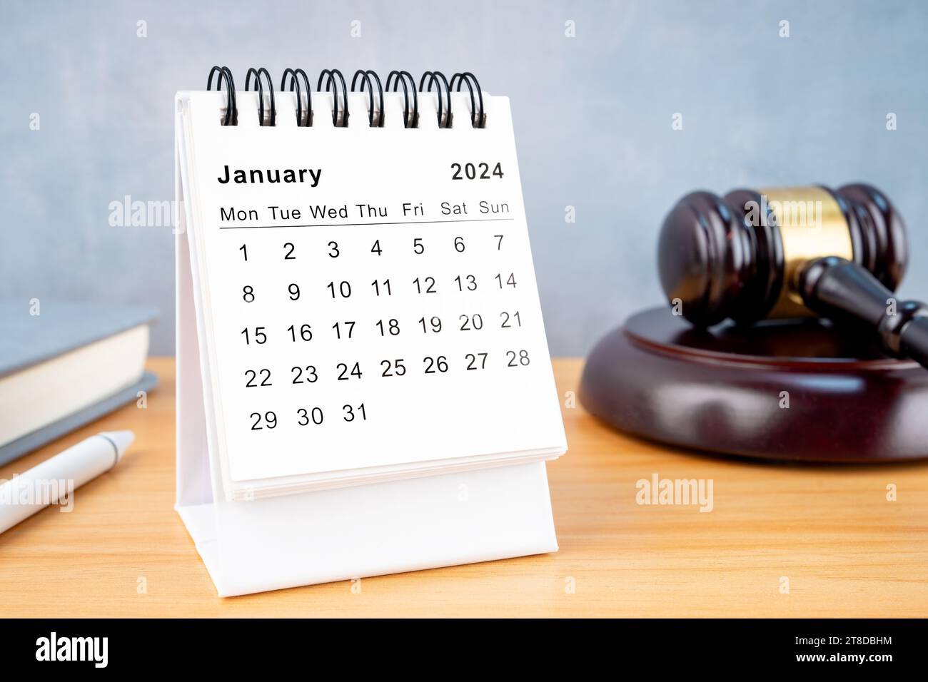 Desk calendar for January 2024 and judge's gavel on the worktable Stock ...