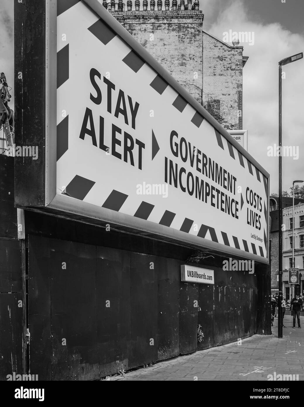 Black and white image of a Covid Billboard in London during the first Lockdown in London. Stock Photo