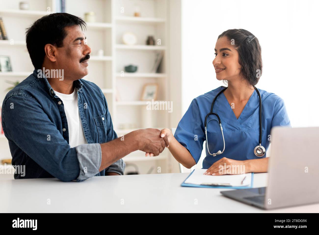 Indian woman doctor shaking hand hi-res stock photography and images ...
