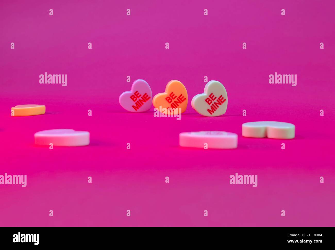 Valentine's Day "Be Mine" Candy Hearts of a Hot Pink Background Stock ...