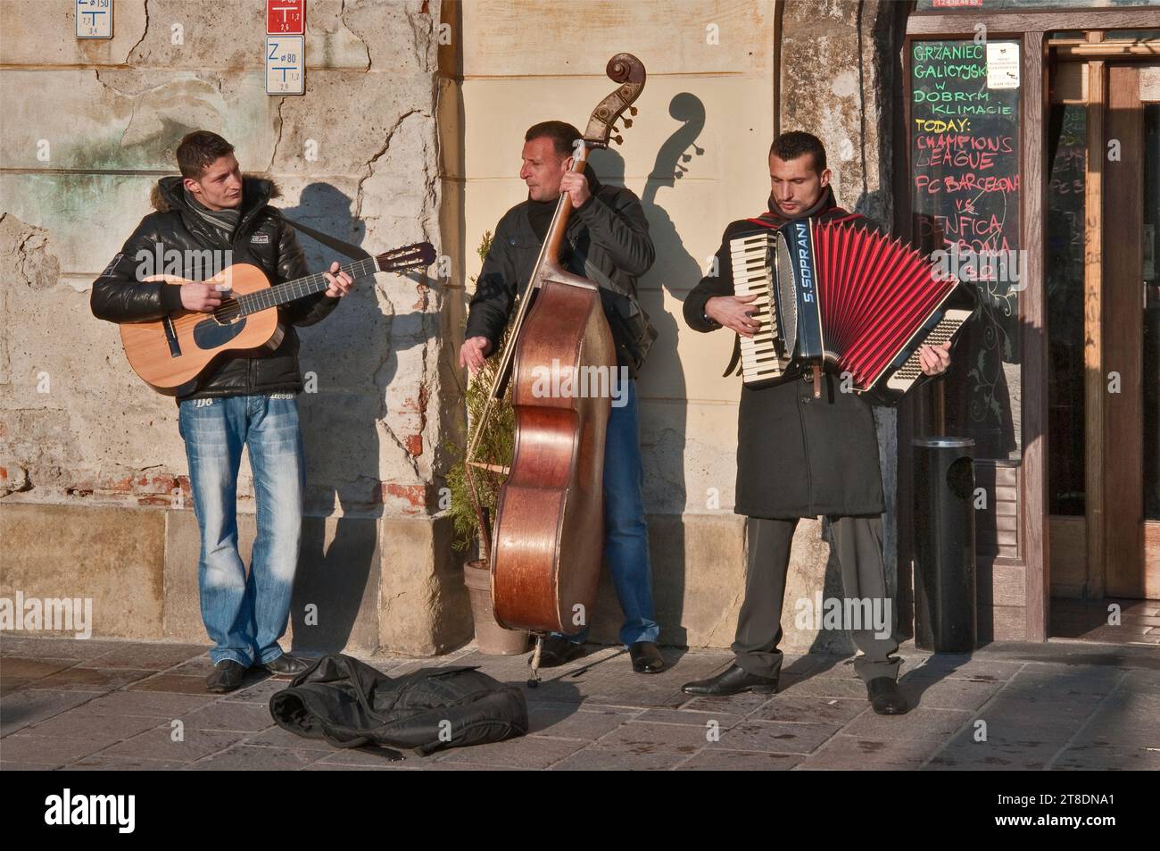 Foreign musicians on street near Plac Mariacki aka Maly Rynek, in Krakow, Poland Stock Photo