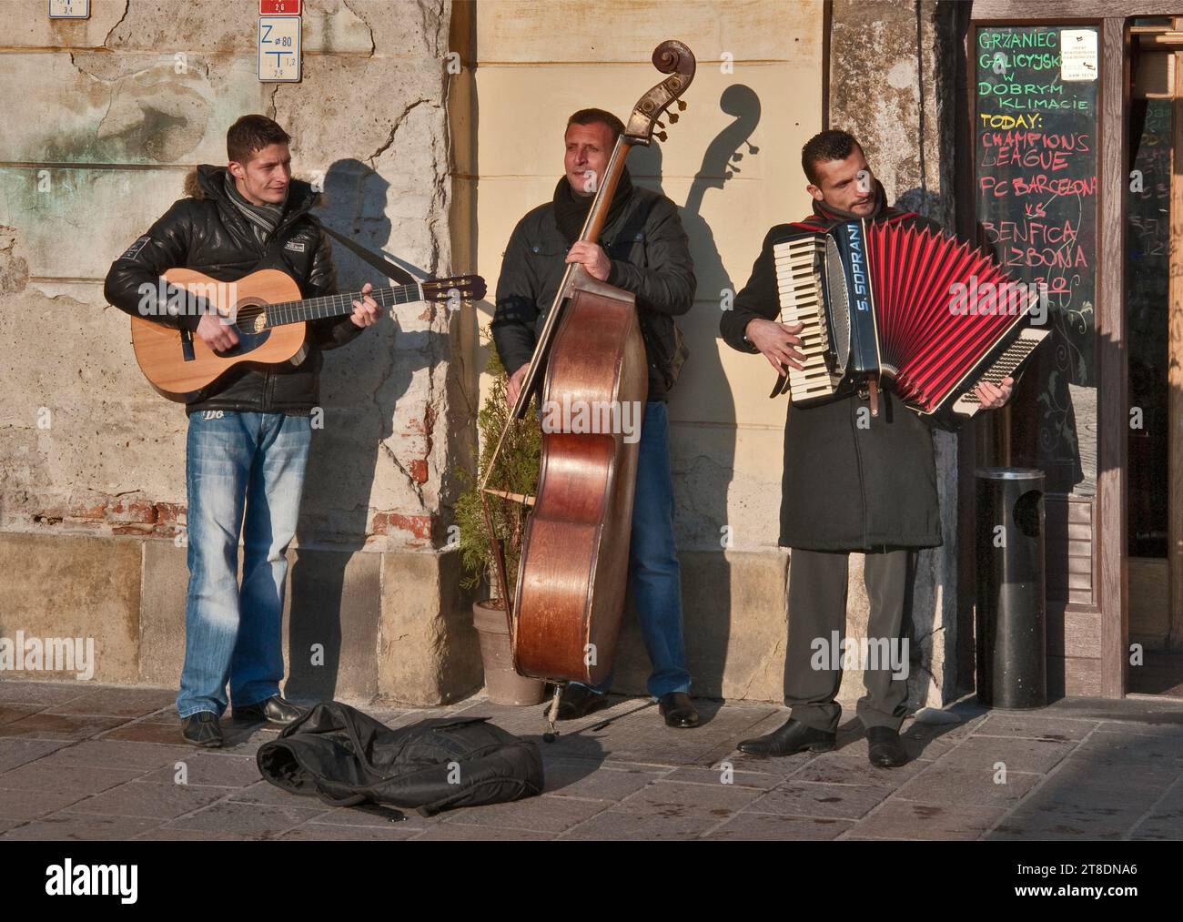 Foreign musicians on street near Plac Mariacki aka Maly Rynek, in Krakow, Poland Stock Photo