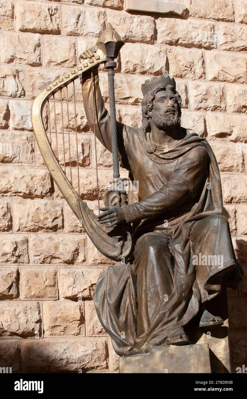 Bronze statue of King David playing the harp outside his tomb in the