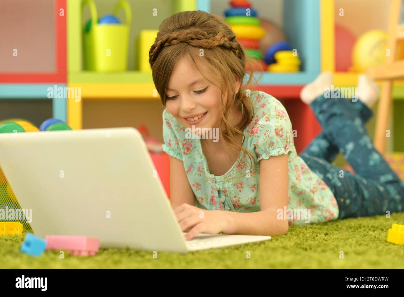 Cute and happy little girl children using laptop computer Stock Photo ...
